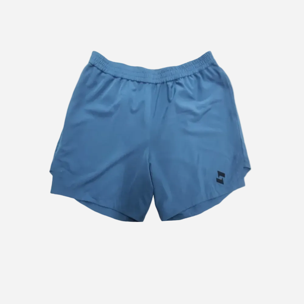 Blue athletic shorts with an elastic waistband and a small sopro black logo on the lower left leg, shown against a plain LIGHT GREY background.