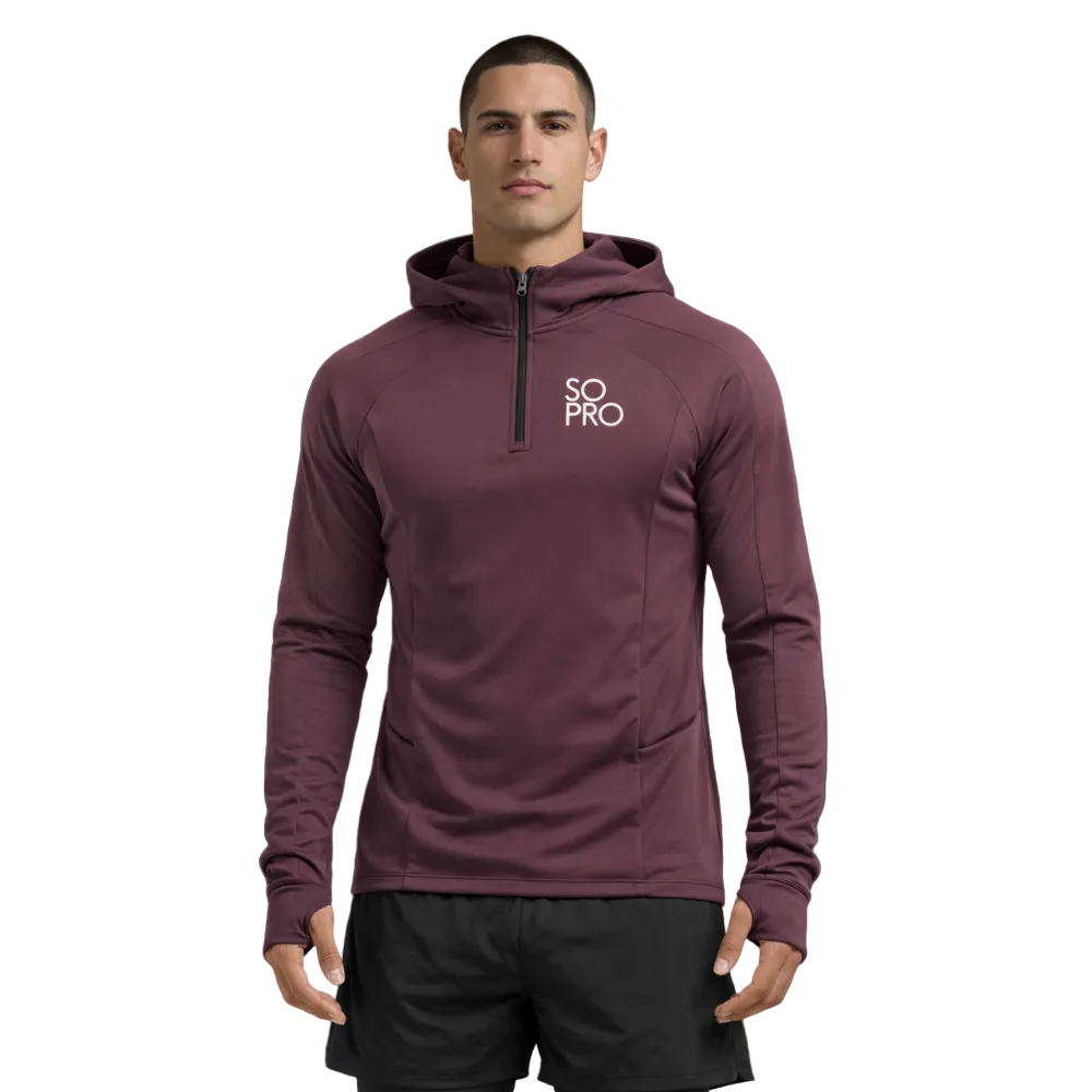 Man wearing a maroon hoodie with 'SO PRO' logo on a dark purple background