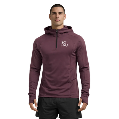 Man wearing a maroon hoodie with 'SO PRO' logo on a dark purple background